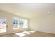 Bright living room featuring a large window and a glass door leading to the backyard at 161 Halite Ln, Waxhaw, NC 28173