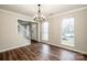 Bright and airy living room featuring hardwood floors, windows, and fresh neutral paint at 316 Reed Creek Rd, Mooresville, NC 28117