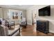 Relaxing sitting area with view into kitchen and hardwood floors at 416 Sabot Ln, Matthews, NC 28105