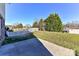 Landscaped backyard with a large grassy area at 7534 April Mist Trl, Huntersville, NC 28078