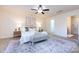 Bright bedroom featuring a comfortable bed and ample space at 7534 April Mist Trl, Huntersville, NC 28078