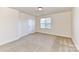 Bright bedroom with neutral walls and carpet flooring at 7534 April Mist Trl, Huntersville, NC 28078