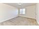 Bright bedroom with neutral walls and carpet flooring at 7534 April Mist Trl, Huntersville, NC 28078