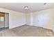 Spacious bedroom with neutral walls and carpet at 7534 April Mist Trl, Huntersville, NC 28078