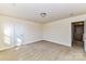Second bedroom with carpet, neutral walls, and door to hallway at 7534 April Mist Trl, Huntersville, NC 28078