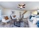 Light and airy living room with a view of the staircase and kitchen at 7534 April Mist Trl, Huntersville, NC 28078