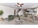 Bright living room with seamless flow, neutral tones, a stylish staircase, and an inviting open layout at 7534 April Mist Trl, Huntersville, NC 28078