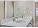 Bathroom featuring double sinks, chrome fixtures, and a large mirror at 8205 Stonemere Ln, Charlotte, NC 28215