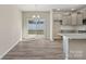 Bright eat-in kitchen with stainless appliances, gray cabinets, granite countertops, and sliding glass doors to yard at 8205 Stonemere Ln, Charlotte, NC 28215