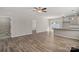 Open concept living room with hard surface floors, neutral paint, and access to backyard at 8205 Stonemere Ln, Charlotte, NC 28215