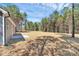 Expansive backyard surrounded by mature trees, offering privacy and space for outdoor activities at 872 Old Mocksville Rd # 1, Statesville, NC 28625