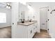 Bright bathroom featuring a double vanity with granite countertops and modern fixtures at 872 Old Mocksville Rd # 1, Statesville, NC 28625