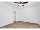 Empty bedroom featuring wood-look vinyl flooring, a ceiling fan, and neutral paint at 872 Old Mocksville Rd # 1, Statesville, NC 28625