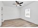 Serene bedroom with neutral palette, modern ceiling fan, and natural light, creating a tranquil atmosphere at 872 Old Mocksville Rd # 1, Statesville, NC 28625