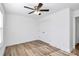 Simple bedroom with ceiling fan and wood-look floors at 872 Old Mocksville Rd # 1, Statesville, NC 28625