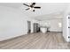 Bright, open-concept living room features modern lighting and beautiful flooring, leading into the kitchen area at 872 Old Mocksville Rd # 1, Statesville, NC 28625