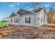 New construction featuring charming white siding and dark shutters at 882 Old Mocksville Rd, Statesville, NC 28625