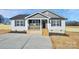 Newly built home featuring gray and white exterior and a concrete driveway at 882 Old Mocksville Rd, Statesville, NC 28625