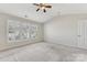 Spacious bedroom with ceiling fan and plantation shutters at 9805 Carson Whitley Ave, Charlotte, NC 28277