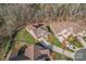 Aerial view of a home featuring an attached garage, large backyard, surrounded by mature trees at 1236 Avalon Pl, Matthews, NC 28104