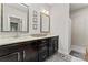 Bathroom featuring double vanities, granite countertops, dark wood cabinets, and a separate tiled shower at 1236 Avalon Pl, Matthews, NC 28104