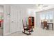 Bedroom featuring a ceiling fan, a rocking chair, a bookshelf, and a desk by the bright window with shutters at 1236 Avalon Pl, Matthews, NC 28104