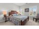 Bedroom with wood-frame bed, shuttered windows, and side tables with lamps at 1236 Avalon Pl, Matthews, NC 28104