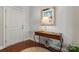 Home entryway featuring a wooden floor, console table, and a white front door at 1236 Avalon Pl, Matthews, NC 28104