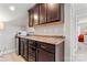 Upstairs kitchenette including mini-fridge, microwave, and granite countertop at 1236 Avalon Pl, Matthews, NC 28104