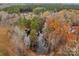 An amazing aerial panorama featuring a charming pond and a forested property at 170 Stillwater Rd, Richfield, NC 28137