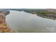 Scenic aerial view of a tranquil lake surrounded by colorful fall trees at 170 Stillwater Rd, Richfield, NC 28137