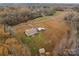 A lovely home with an open-air detached garage in a tranquil, wooded setting at 170 Stillwater Rd, Richfield, NC 28137