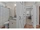 Bright bathroom features a granite vanity, decorative mirror and stylish barn door at 170 Stillwater Rd, Richfield, NC 28137