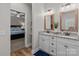 Well-lit bathroom with double vanities, granite countertops and views to main bedroom at 170 Stillwater Rd, Richfield, NC 28137