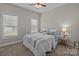 Comfortable bedroom with a ceiling fan, two windows, and carpeted floors at 170 Stillwater Rd, Richfield, NC 28137