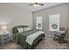 Cozy bedroom with a ceiling fan, two windows, and carpeted floors at 170 Stillwater Rd, Richfield, NC 28137