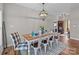 Elegant dining room with a wooden table, seating for six, and a chandelier, perfect for gatherings at 170 Stillwater Rd, Richfield, NC 28137
