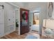Inviting entryway with hardwood floors, a decorative wreath, and a glimpse of the front porch at 170 Stillwater Rd, Richfield, NC 28137