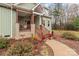 Inviting front exterior with a cozy porch, holiday wreaths, and well-maintained landscaping at 170 Stillwater Rd, Richfield, NC 28137
