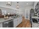 Stylish kitchen features a granite island, modern appliances, and a view into the dining area at 170 Stillwater Rd, Richfield, NC 28137