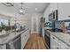 Modern kitchen with granite countertops, stainless steel appliances, and wooden flooring at 170 Stillwater Rd, Richfield, NC 28137