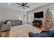 Inviting living room with large windows, cozy furniture, and hardwood flooring at 170 Stillwater Rd, Richfield, NC 28137