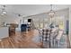 Open floor plan featuring living, dining areas and breakfast bar with modern light fixtures at 170 Stillwater Rd, Richfield, NC 28137