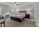 Comfortable main bedroom featuring a ceiling fan, carpet, and bedside lamps at 170 Stillwater Rd, Richfield, NC 28137