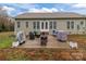 Back patio featuring an outdoor dining set, grill, and ample space for gatherings at 170 Stillwater Rd, Richfield, NC 28137