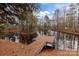 Picturesque pond with a private dock surrounded by mature trees, perfect for outdoor enjoyment at 170 Stillwater Rd, Richfield, NC 28137