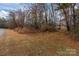 Expansive yard area with mature trees at 170 Stillwater Rd, Richfield, NC 28137