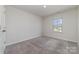 This carpeted bedroom offers natural light from the window at 3033 Eastcott Ave, Monroe, NC 28110