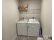 Practical laundry area with a washer, dryer, and overhead shelving at 3033 Eastcott Ave, Monroe, NC 28110