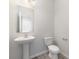 Simple powder room with a pedestal sink, a toilet and neutral decor at 3033 Eastcott Ave, Monroe, NC 28110